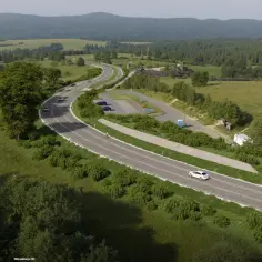 Nowa droga w Bieszczadach, część pętli bieszczadzkiej, wijąca się wśród zielonych wzgórz i lasów.